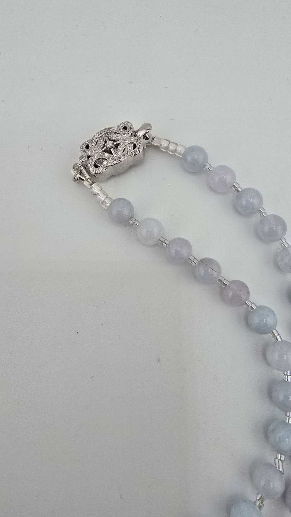 Collier en Aigue Marine et fermoir couture en argent rhodié 925/1000