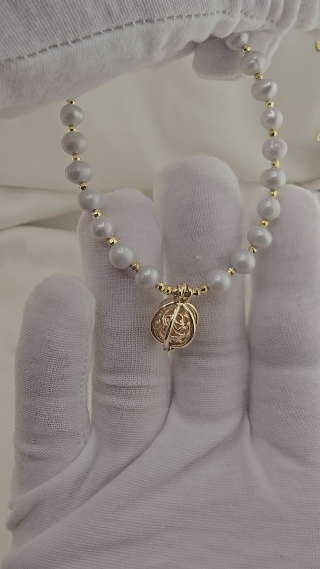 Gray cultured pearl necklace in its case
