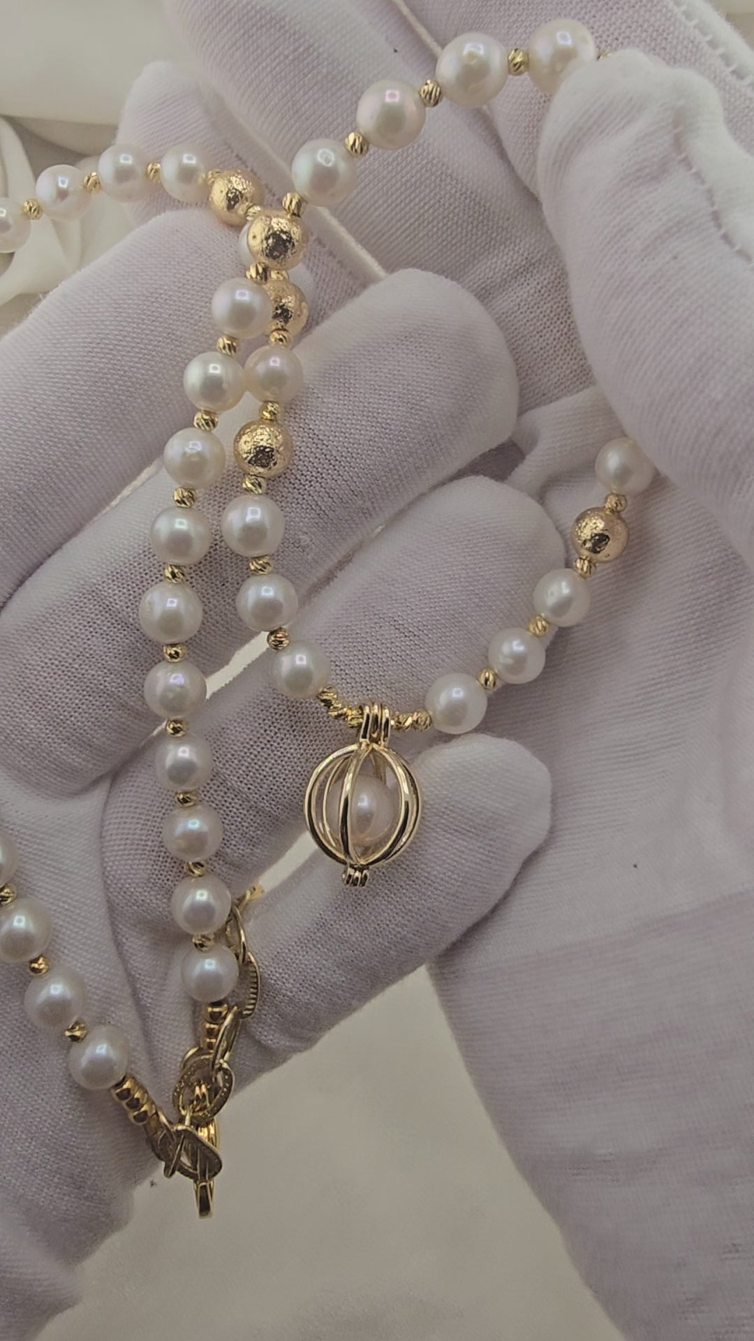 White cultured pearl necklace in its case