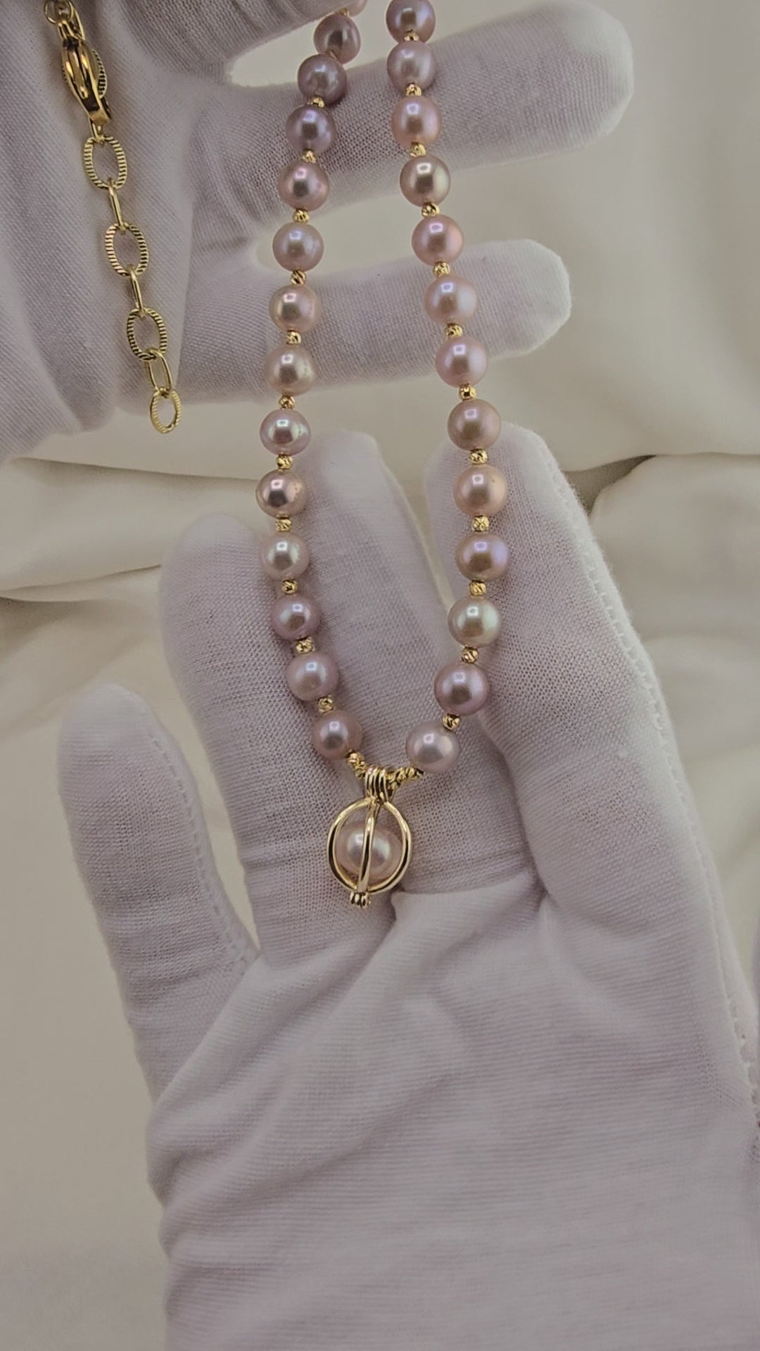 Pink cultured pearl necklace in its case