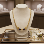 Collier en plaqué or et deux perles de culture bleu marine