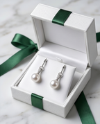 Rhinestone and cultured pearl earrings