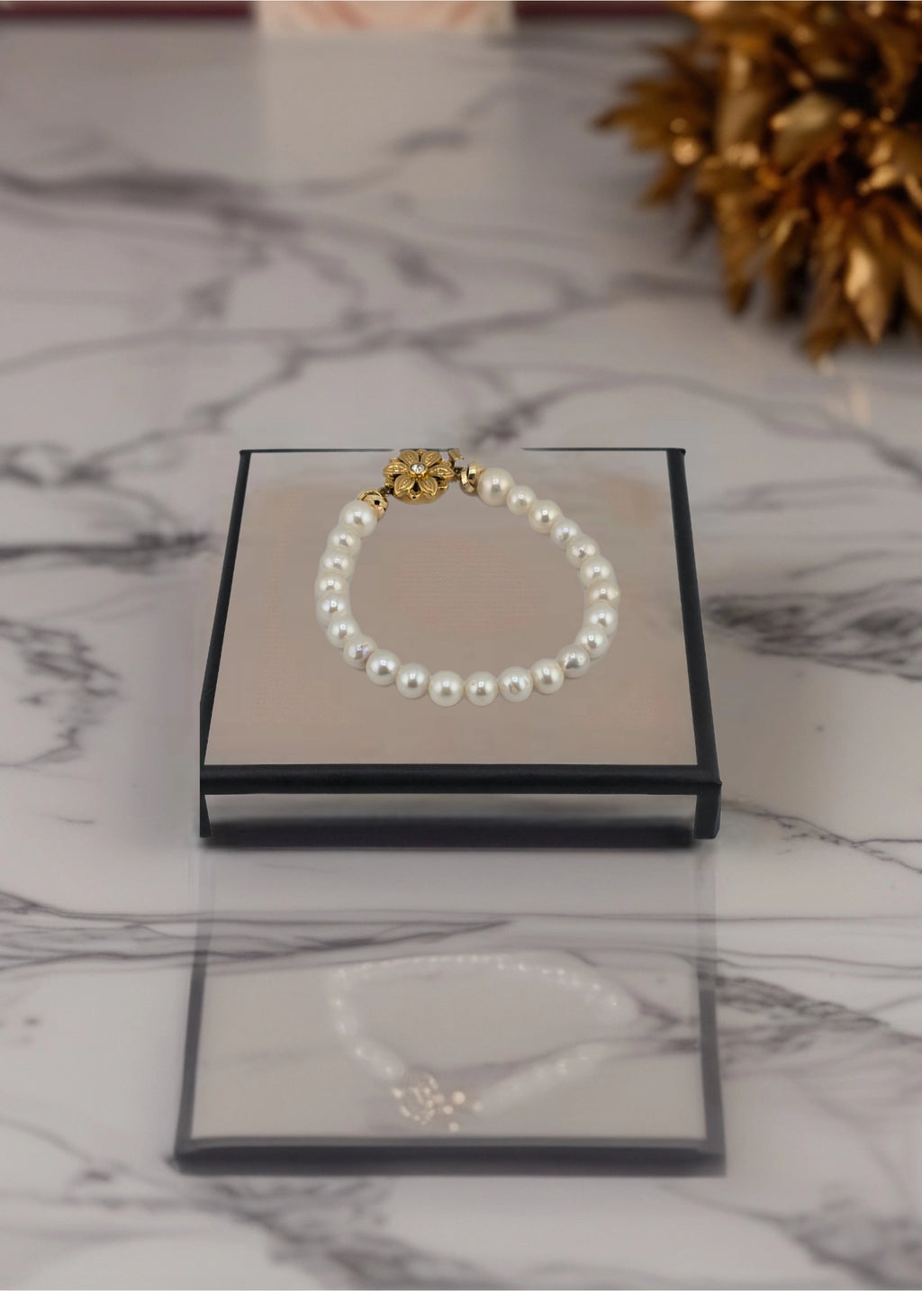 Bracelet perles de culture et fermoir couture