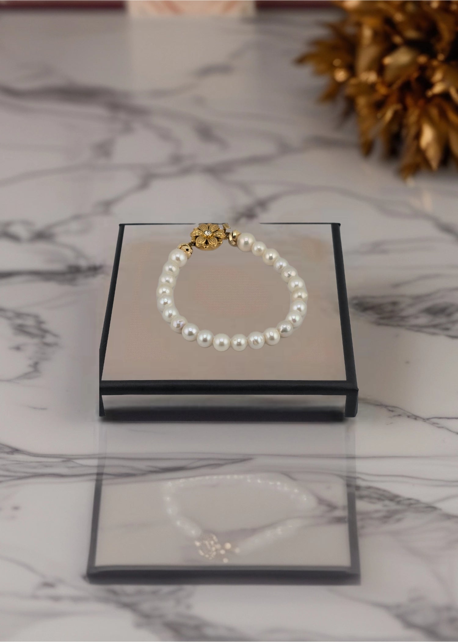 Bracelet perles de culture et fermoir couture