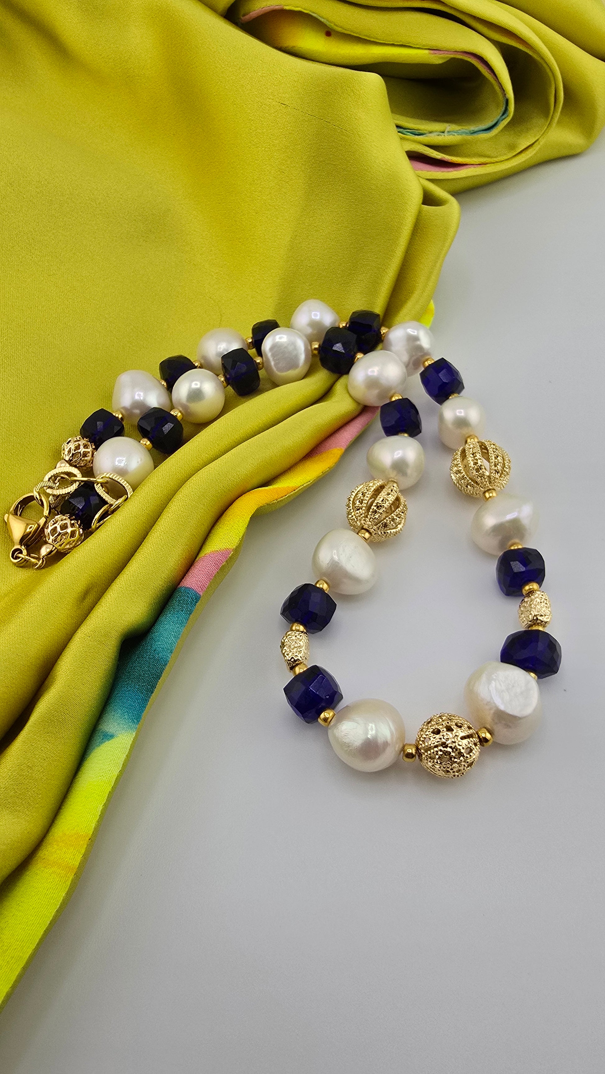 Baroque cultured pearl necklace, blue quartz in its case