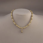 Collier en plaqué or et son pendentif