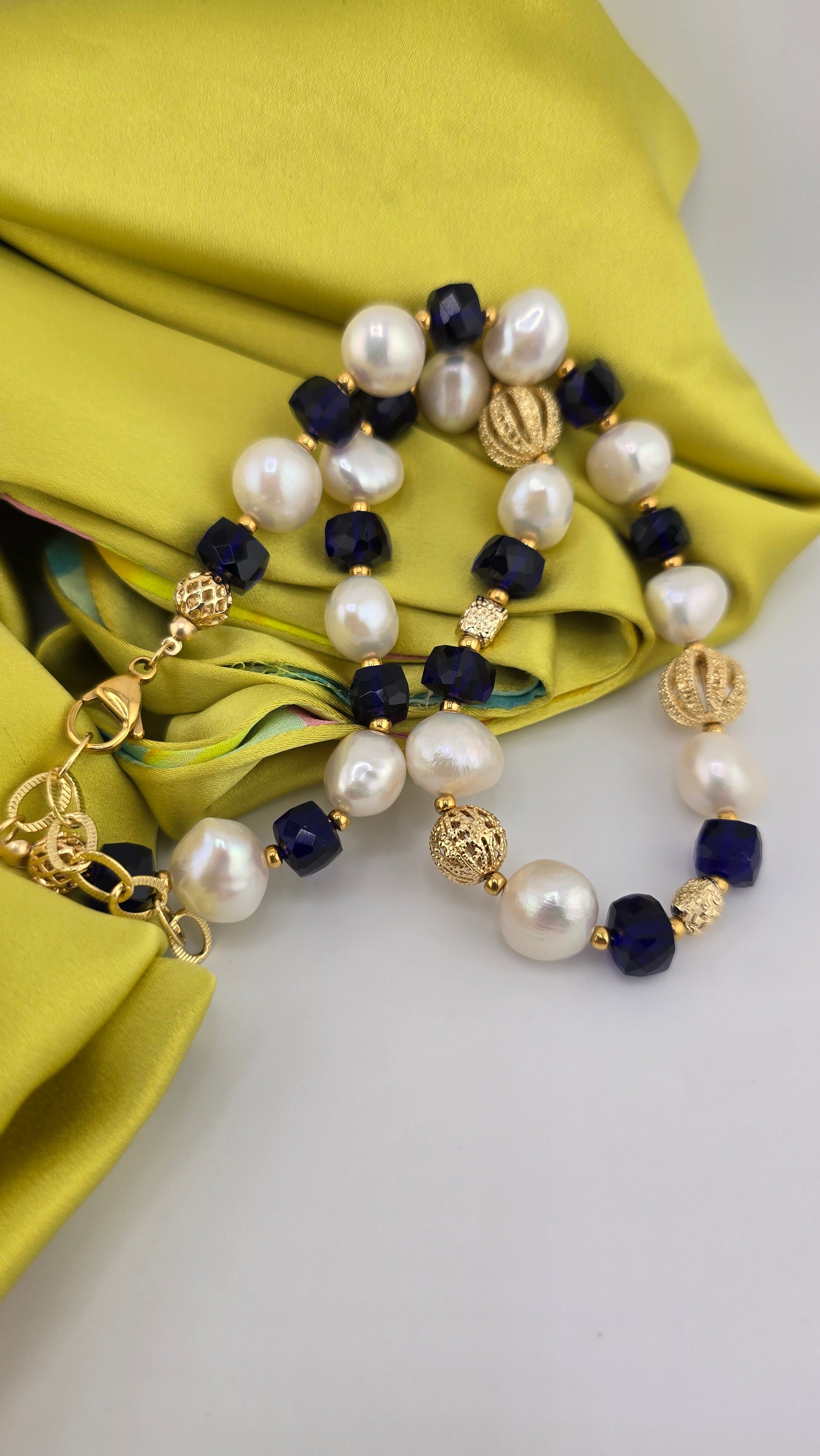 Baroque cultured pearl necklace, blue quartz in its case