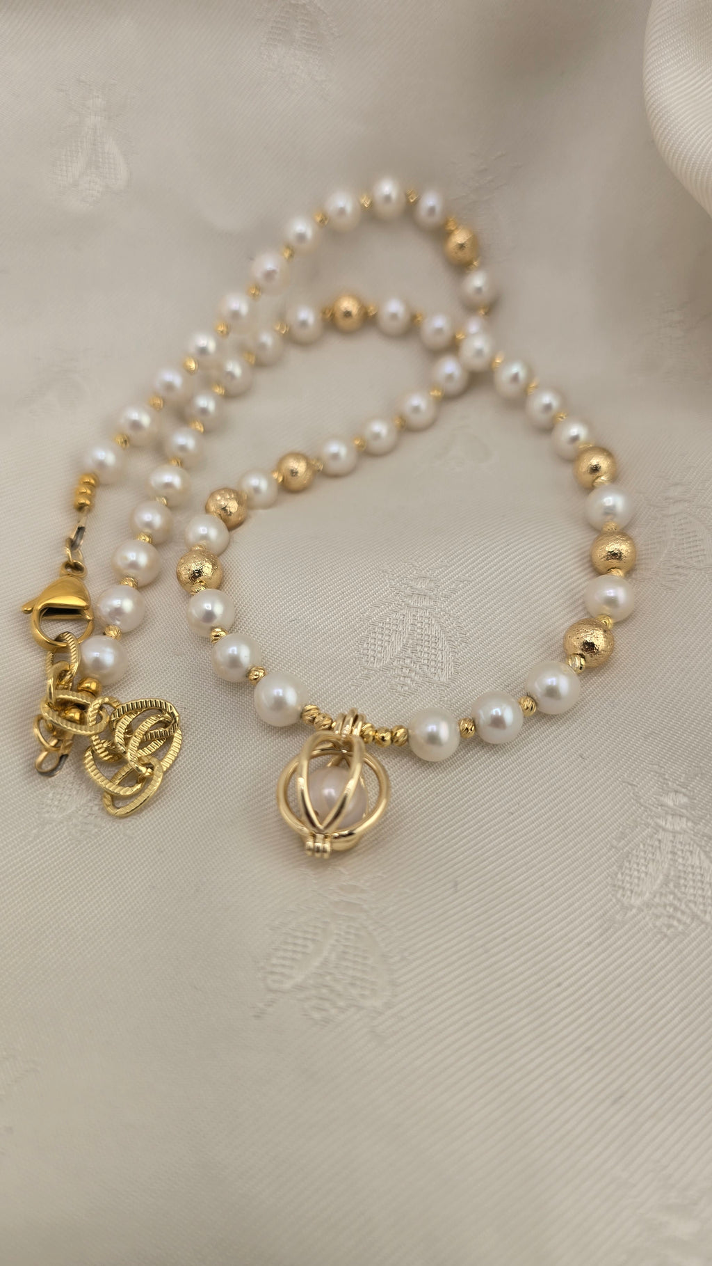 White cultured pearl necklace in its case
