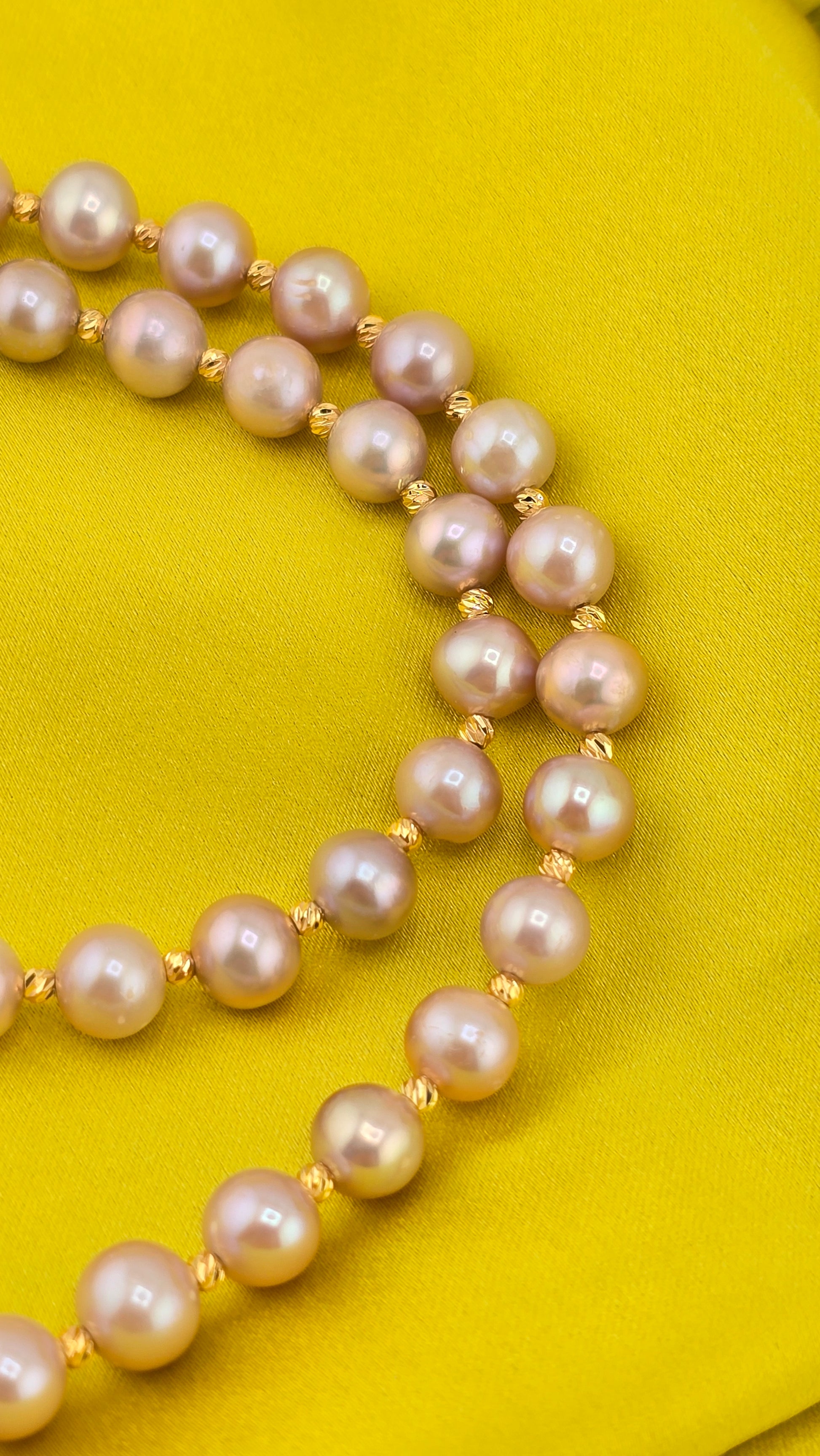 Pink cultured pearl necklace in its case