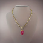 Collier avec pendentif en agate rose