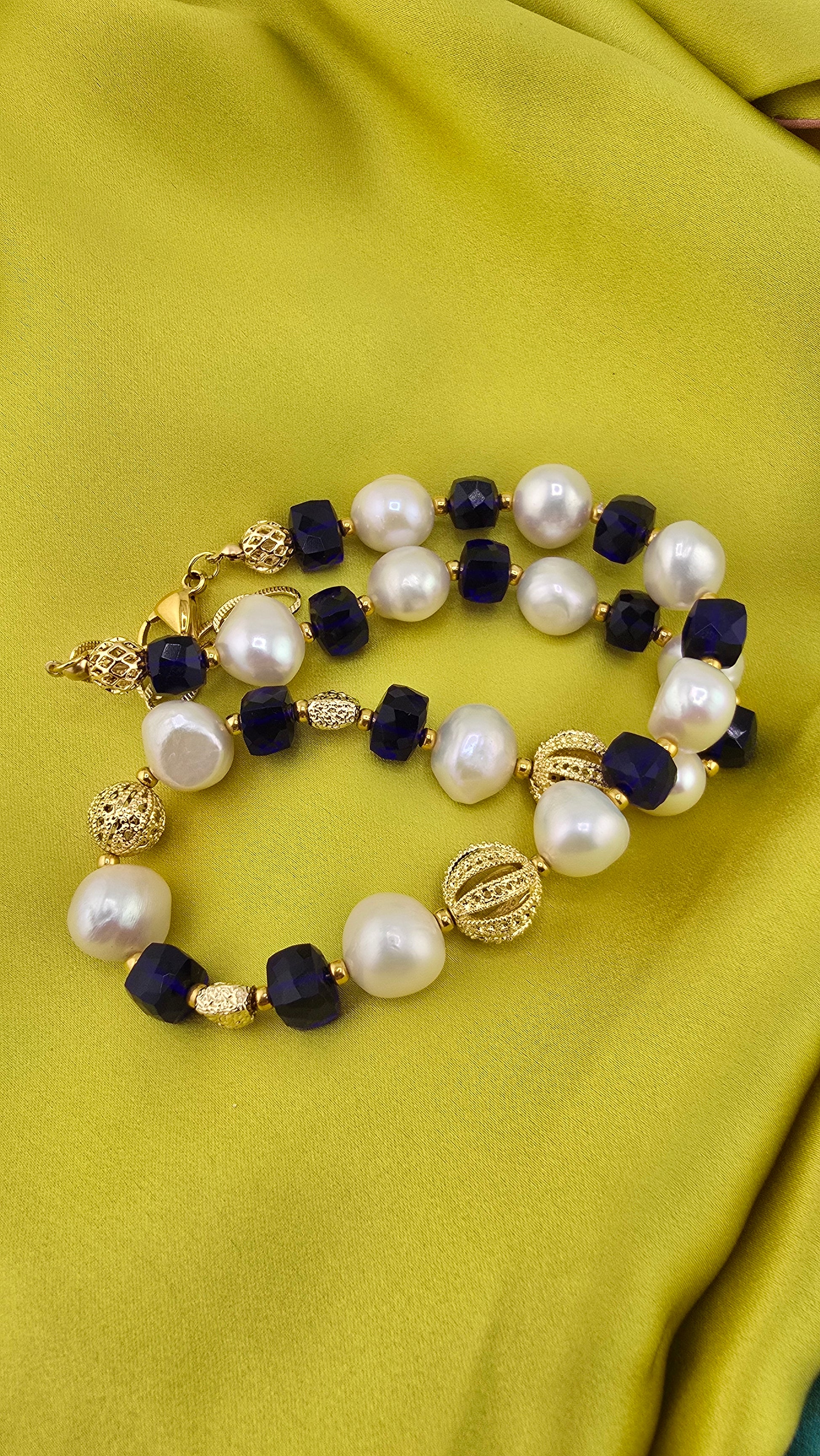 Baroque cultured pearl necklace, blue quartz in its case