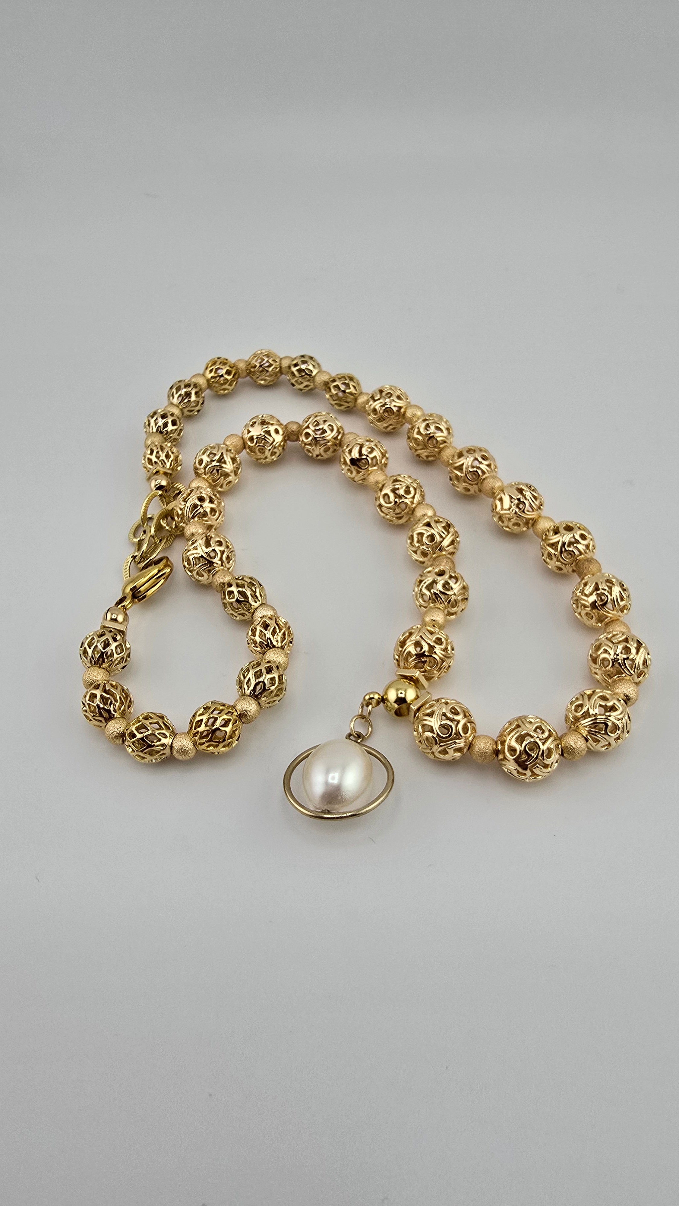 Collier en plaqué or et sa perle de culture en pendentif