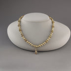 Collier en plaqué or et son pendentif